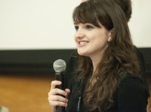 A woman with a microphone.