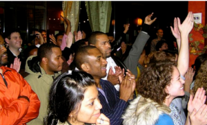 An audience that looks engaged in the presentation.