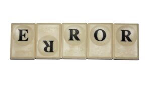 Tiles that spell "error" with the first "R" upside down.