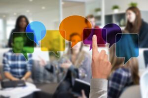 A group of people with speech bubbles overlaying their faces.