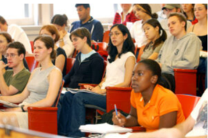 A group of college students in a lecture hall.