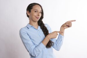 A woman pointing.