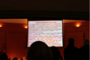 PowerPoint slide crammed with text.