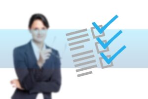 A woman in business dress with a checklist superimposed.