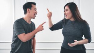 A man and woman arguing.