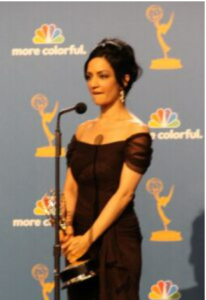 Actress Archie Panjabi holding an Emmy award, 2010.