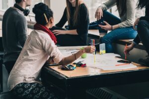 People meeting informally around a table.