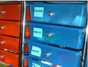 Labeled red and blue file drawers.