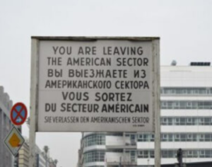 A historic sign at Checkpoint Charlie in Berlin, saying "You are leaving the American Sector."